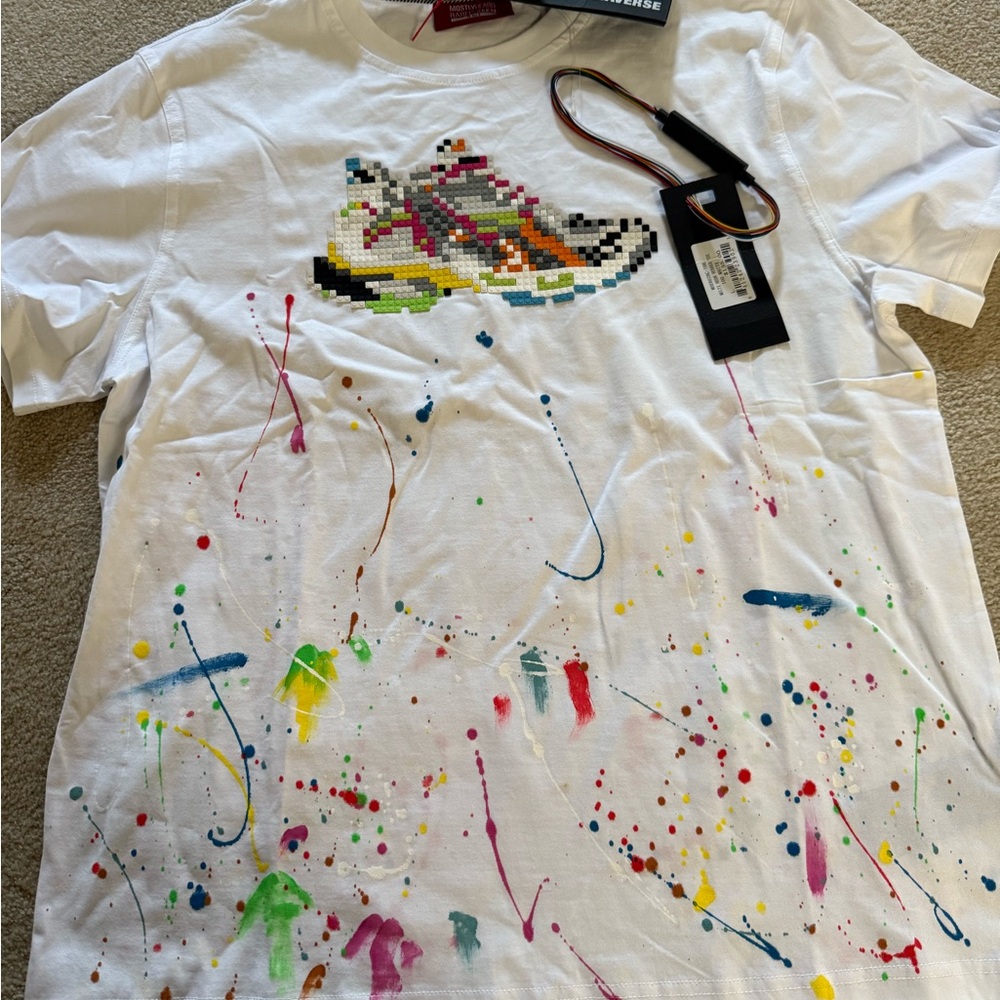 Mostly Heard Rarely Seen White Tee with Colorful Splatter and Sneaker Design